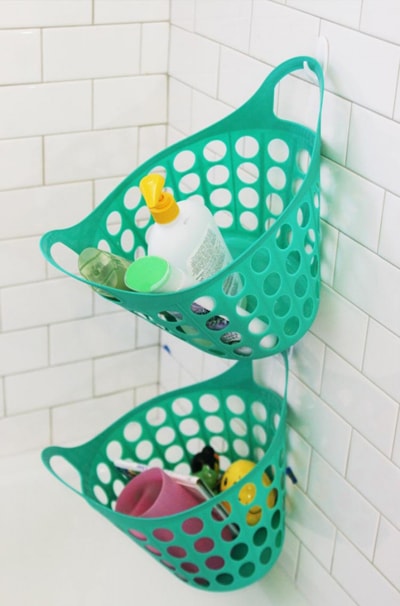bins hanging on command hooks in the shower