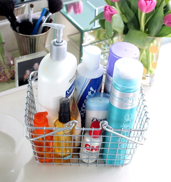 Wire basket on a counter containing hair and bath products