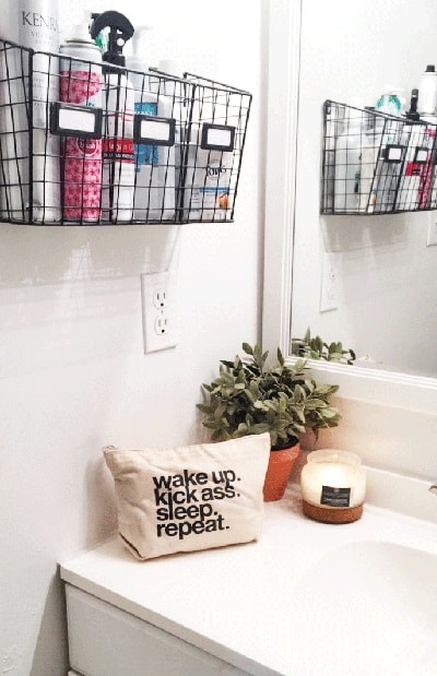 Wire basket fixed on the wall containing hair products